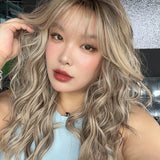 JBEXTENSION 22 Inches Scalpiana Long Wave Blonde Highlight 3.5X4 Hard Silky Top Natural Scalp Effect Wig with Bangs OSSIE BLONDE HIGHLIGHT