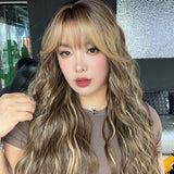 JBEXTENSION 28 Inches Scalpiana Long Wave Hazelnut 3.5X4 Hard Silky Top Natural Scalp Effect Wig with Bangs OSSIE LONG - HAZELNUT