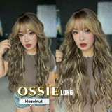 JBEXTENSION 28 Inches Scalpiana Long Wave Hazelnut 3.5X4 Hard Silky Top Natural Scalp Effect Wig with Bangs OSSIE LONG - HAZELNUT