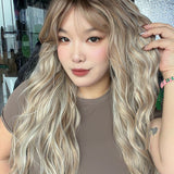 JBEXTENSION 28 Inches Scalpiana Long Wave Silver Sand Blonde 3.5X4 Hard Silky Top Natural Scalp Effect Wig with Bangs OSSIE LONG - SILVER SAND BLONDE